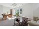 Well-lit office with a wooden table and seating with natural lighting at 642 Stickley Oak Way, Woodstock, GA 30189