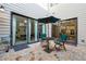Private outdoor patio with seating and sliding glass doors to indoor rooms at 642 Stickley Oak Way, Woodstock, GA 30189