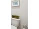 Powder room toilet with a natural plant in a wooden box at 642 Stickley Oak Way, Woodstock, GA 30189