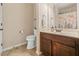 Bathroom featuring tile flooring, a wood vanity, and framed mirror at 1305 Lanier Ct, Hampton, GA 30228