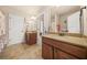 This spacious bathroom offers double sinks, neutral tile, and plenty of cabinet space at 1305 Lanier Ct, Hampton, GA 30228