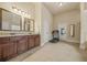 Bright bathroom featuring a double vanity, tile floors, and plenty of counter space at 1305 Lanier Ct, Hampton, GA 30228