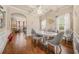 Elegant dining room featuring hardwood floors, modern decor, and a view to another living area at 1305 Lanier Ct, Hampton, GA 30228