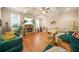 Inviting living room featuring a stone fireplace, coffered ceiling, and hardwood floors at 1305 Lanier Ct, Hampton, GA 30228