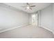 Cozy bedroom with a ceiling fan, light gray walls and carpet, leading to an attached bathroom for added privacy at 1501 Clairmont Rd # 1624, Decatur, GA 30033