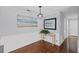 Dining room with wood floors featuring modern lighting fixture at 1905 Countryside Se Pl # 1905, Smyrna, GA 30080