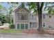 Exterior view of this home showcasing a two-story design, and front yard at 1905 Countryside Se Pl # 1905, Smyrna, GA 30080