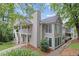 Exterior view of this home showcasing a two-story design, front yard, and porch at 1905 Countryside Se Pl # 1905, Smyrna, GA 30080