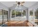 Bright sunroom with floor to ceiling windows, slider door and ceiling fan at 1905 Countryside Se Pl # 1905, Smyrna, GA 30080