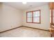 Bright bedroom featuring neutral carpet, natural light, and wood trim at 1975 Skidmore Cir, Lawrenceville, GA 30044