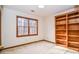 Bedroom with large window and a built in bookcase at 1975 Skidmore Cir, Lawrenceville, GA 30044