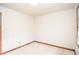 Neutral bedroom featuring neutral carpet, natural light, and wood trim at 1975 Skidmore Cir, Lawrenceville, GA 30044