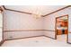 Dining room with classic wallpaper, hardwood trim and view into kitchen at 1975 Skidmore Cir, Lawrenceville, GA 30044