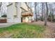 Back view of home showing garages, deck, and yard at 1975 Skidmore Cir, Lawrenceville, GA 30044