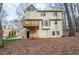 Rear view of the house highlighting the deck, bay window, and backyard at 1975 Skidmore Cir, Lawrenceville, GA 30044