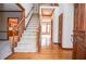 Welcoming foyer with hardwood floors, staircase, and traditional wood trim throughout at 1975 Skidmore Cir, Lawrenceville, GA 30044