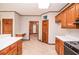 Spacious kitchen with white counter tops, and a door leading to the dining room at 1975 Skidmore Cir, Lawrenceville, GA 30044