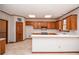 Spacious kitchen featuring oak cabinets, and a breakfast bar at 1975 Skidmore Cir, Lawrenceville, GA 30044