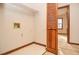 Laundry area with a door to a bedroom, a shelf and hookups, and tile floors at 1975 Skidmore Cir, Lawrenceville, GA 30044