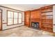 Cozy living room featuring a fireplace and bookshelves at 1975 Skidmore Cir, Lawrenceville, GA 30044