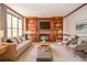 Virtual Staging: Cozy living room with fireplace, built-in bookshelves and neutral decor at 1975 Skidmore Cir, Lawrenceville, GA 30044