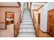 Staircase featuring wood trim and paneled accents and access to the kitchen at 1975 Skidmore Cir, Lawrenceville, GA 30044