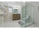 Modern bathroom featuring a glass-enclosed shower, vanity, and neutral decor at 2262 Ridgedale Ne Rd, Atlanta, GA 30317