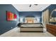 Comfortable bedroom features a large bed with blue walls at 2262 Ridgedale Ne Rd, Atlanta, GA 30317