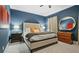 Comfortable bedroom features a large bed with blue walls at 2262 Ridgedale Ne Rd, Atlanta, GA 30317