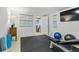 A functional exercise room with an exercise machine, posters, and black rubber flooring at 2262 Ridgedale Ne Rd, Atlanta, GA 30317