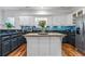 Spacious kitchen featuring white cabinets, a large island, and stainless steel appliances at 2262 Ridgedale Ne Rd, Atlanta, GA 30317