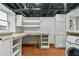 Functional laundry room with storage shelves, work surface, and view to outdoors at 2262 Ridgedale Ne Rd, Atlanta, GA 30317