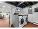 Well-equipped laundry room featuring modern appliances, ample counter space, and tiled floors at 2262 Ridgedale Ne Rd, Atlanta, GA 30317