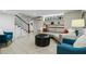 Basement living room with painted brick, tile floor, and natural light at 2262 Ridgedale Ne Rd, Atlanta, GA 30317