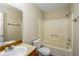 Bathroom featuring a tub-shower combo, a single sink, and a clean, functional design at 241 The Esplanade Se Way, Loganville, GA 30052