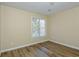 Bedroom with wood floors and a window, providing a blank canvas for personalization at 241 The Esplanade Se Way, Loganville, GA 30052