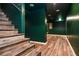 Wooden staircase descends into a finished basement, showcasing the newly renovated space at 970 Winding Creek Trl, Atlanta, GA 30328