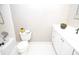 Clean bathroom with white tile, updated vanity, shower and tub at 970 Winding Creek Trl, Atlanta, GA 30328