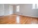 Bright bedroom featuring hardwood floors, natural light, and closet space at 970 Winding Creek Trl, Atlanta, GA 30328