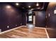 Charming bedroom features wood floors, a ceiling fan, and leads to another room via a doorway at 970 Winding Creek Trl, Atlanta, GA 30328