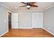 Bedroom featuring hardwood floors, ceiling fan, closet and one window at 970 Winding Creek Trl, Atlanta, GA 30328