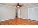 Bedroom with hardwood floors, ceiling fan, closet and one window at 970 Winding Creek Trl, Atlanta, GA 30328