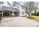 View of the side of the house with a covered carport and an attached deck at 970 Winding Creek Trl, Atlanta, GA 30328