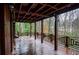 Long wooden deck with railings and a beautiful wooded view at 970 Winding Creek Trl, Atlanta, GA 30328