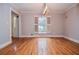 Bright dining room featuring hardwood floors and a window with shutters at 970 Winding Creek Trl, Atlanta, GA 30328