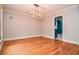 Dining room with hardwood floors, fresh paint and a modern light fixture at 970 Winding Creek Trl, Atlanta, GA 30328