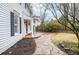 Close-up of a porch entrance with stone steps and a manicured flower bed at 970 Winding Creek Trl, Atlanta, GA 30328