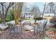 Charming front yard seating area overlooking a two-story house and lush greenery at 970 Winding Creek Trl, Atlanta, GA 30328