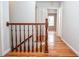 Hallway with hardwood floors and wooden railing at 970 Winding Creek Trl, Atlanta, GA 30328