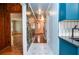 Hallway view of modern kitchen, hardwood floors, and unique wall decor at 970 Winding Creek Trl, Atlanta, GA 30328